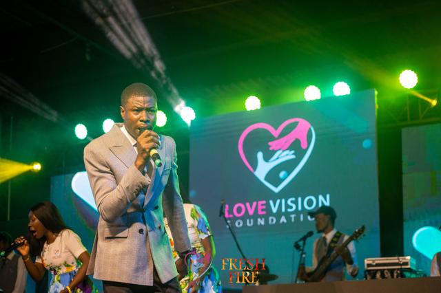 Man holding two small children